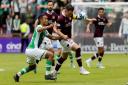 Allan Delferrière of Hibs in action against Hearts' Lawrence Shankland during the last derby meeting