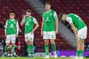 The Hibs players are a picture of dejection at full-time at Hampden