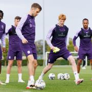 Rory Whittaker, centre, takes part in training ahead of Hibs' Viaplay Cup clash with St Mirren. (Image: Ross Parker / SNS Group)