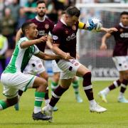 Allan Delferrière of Hibs in action against Hearts' Lawrence Shankland during the last derby meeting