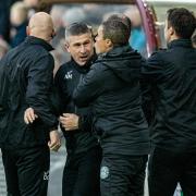 Nick Montgomery celebrates Élie Youan's equaliser at Tynecastle with his coaching staff