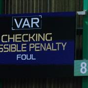 Indication of a VAR review during a Hibs game at Easter Road